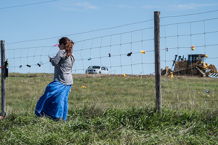 As construction began in early August, many feared that cultural and sacred sites would be destroyed. While many would initially watch from the across the fence, on Sept. 3, when their fears became reality, they no longer could remain behind. Dustin White photo